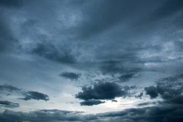 Dramatic dark storm thundercloud rain clouds on black sky background. Dark thunderstorm clouds...