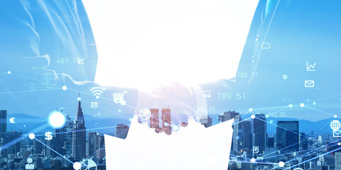 Group of business people shaking hands and digital network concept. Wide angle visual for banners or advertisements.