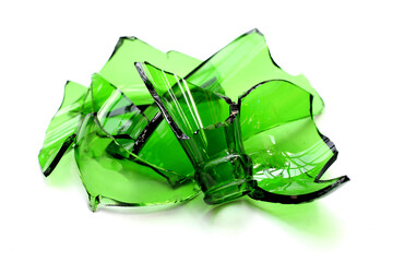 Sharp green glass shards scattered on a white background.