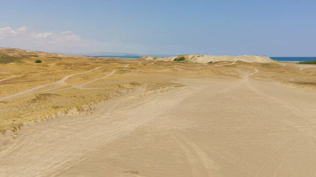 Top view of Paoay sand dune. Sand dunes near to the sea with sky. Ilocos Norte, Philippines.