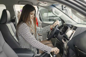 Portrait of caucasian young female driver in a car