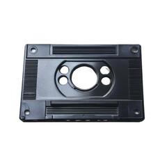 Black plastic piece with a hole in the middle