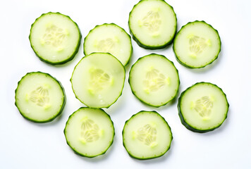 Artistic top-down food image of round cucumber slices neatly placed on a white backdrop, showcasing fresh produce with soft focus edges and crisp centers