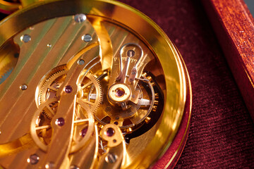 Intricate mechanics of a close-up mechanical watch revealing the artistry and precision behind its...