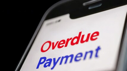 Overdue payment notification on smartphone screen with plan to manage finance, debt tracking, and avoid penalties or late fees effectively