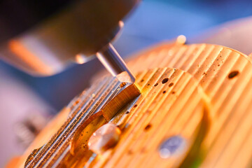 Precision milling in the manufacturing process of clockwork mechanisms in a workshop setting where...