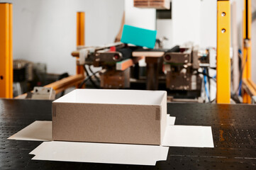 Dynamic manufacturing process of decorative cardboard boxes in a vibrant factory setting for gift packaging