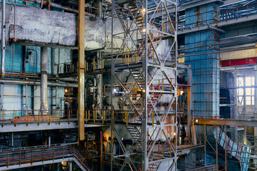 Industrial facility showcasing complex machinery and structures in a large-scale construction area...