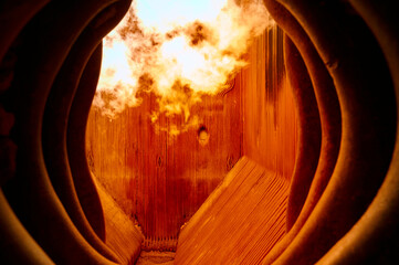 Interior view of operating steam boiler furnace showing flame combustion and heat exchange at a...