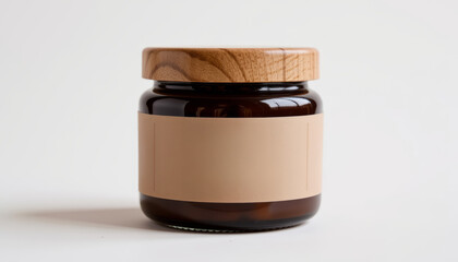 Brown glass jar with wooden lid and blank beige label on white background, natural and modern style