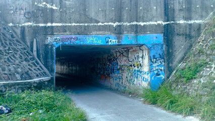 A tunnel located beneath the highway, designed to allow safe passage for vehicles, pedestrians, or...