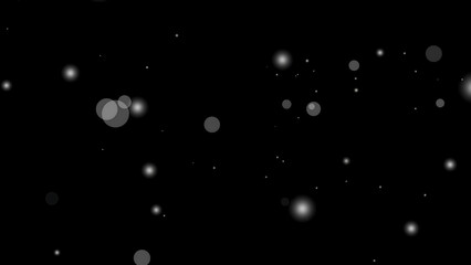 White particle overlay creates a field of sparkling bokeh lights on a black background