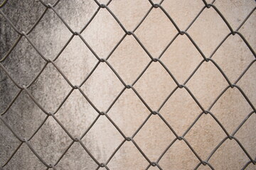 old wire mesh on dirty wall, construction industry