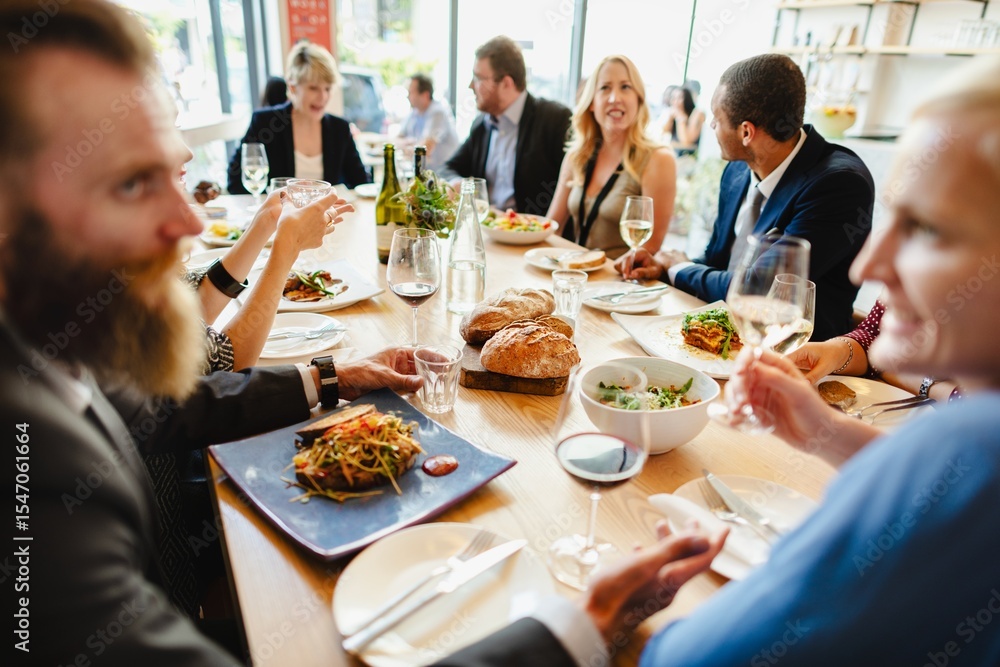 Poster a diverse group of people enjoying a meal together at a stylish table share laughter and fine dining