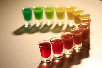 Colorful cocktail glasses lined up
