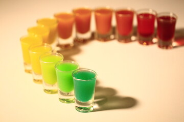 Colorful cocktail glasses lined up