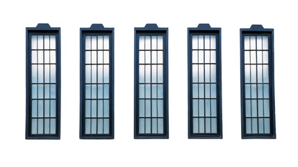 Obraz premium Five tall, rectangular windows with grid pattern and dark frames are aligned row, creating symmetrical and modern architectural design. windows reflect soft, diffused light, adding serene