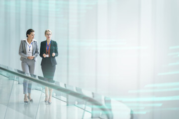 Two businesswomen working together in an office building