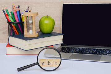 A Study Workspace Featuring a Laptop, Various Books, and Essential Educational Tools for Learning