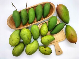 Mango is an oriental fruit that is popularly grown in tropical areas. There are many varieties. It can be eaten both raw and ripe. It has both sour and sweet flavors. white background.