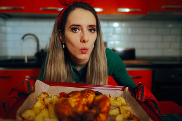 Housewife Shows She Cooked Chicken and Potatoes in the Oven. Proud woman showing off her homemade traditional recipe
