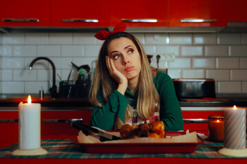 Thoughtful Bored Housewife Waiting for Guests to Arrive. Unhappy woman feeling bored and tired cooking for the holidays 
