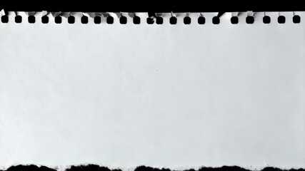 Close-up of a perforated white paper sheet with torn bottom edge against black background for presentations or creative projects. - Powered by Adobe