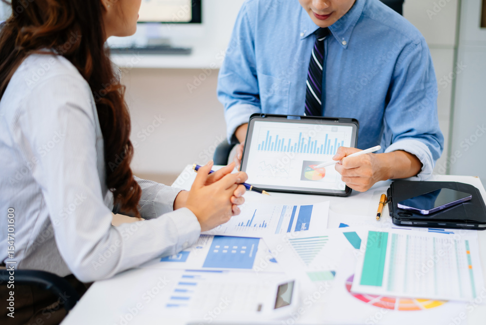 Poster business documents on office table with smart phone and calculator digital tablet and graph business