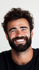 Fototapeta premium 44. A man with a beard smiling under a white background
