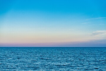 Experience tranquility with this beautiful ocean view at twilight. The calm sea and soft sky blend...