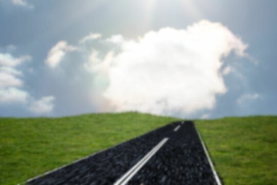 Fototapeta Diminishing view of road amidst grass