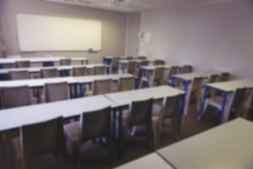Desk and chairs in classroom