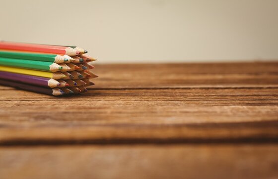 Color pencils on wooden table