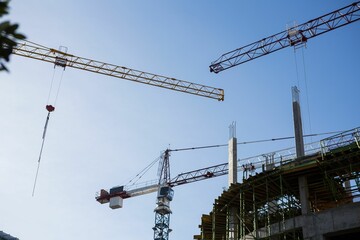 Crane and building construction site