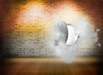 Open safe in dust cloud on brick lined wall