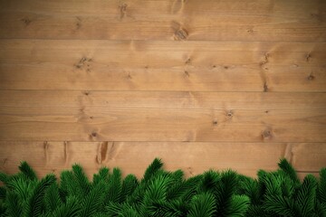 Fir branches over wooden planks