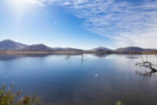 Fototapeta Tranquil scene of river by mountains