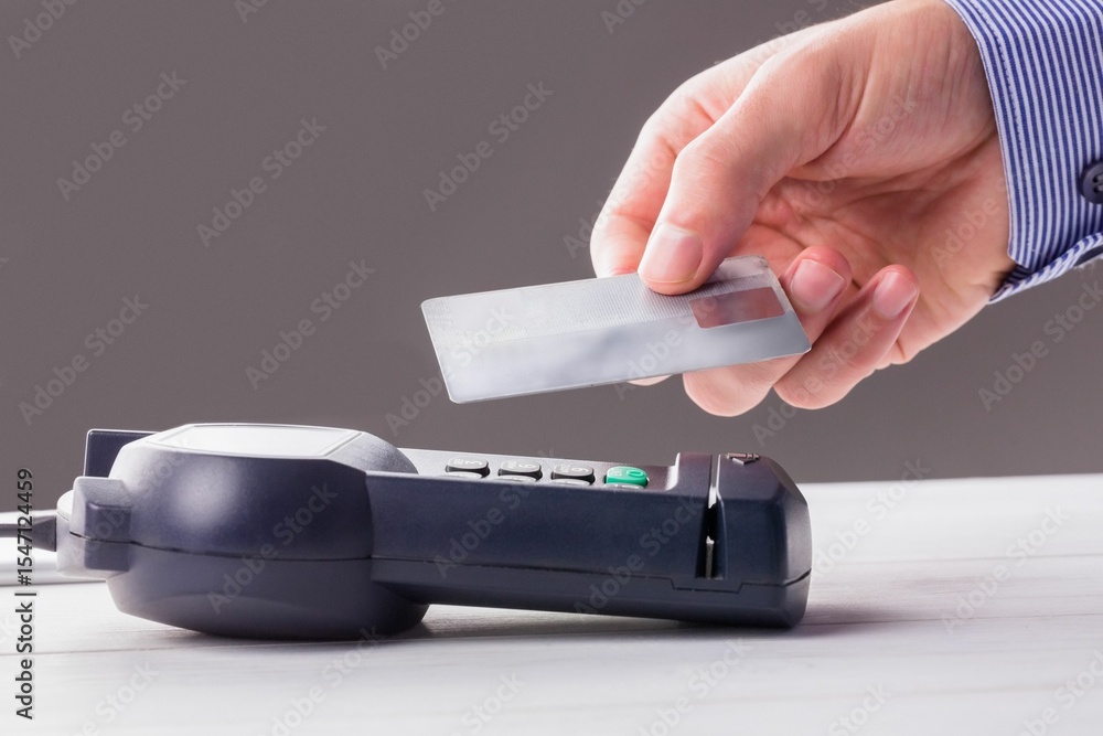 Poster man using smartphone to express pay