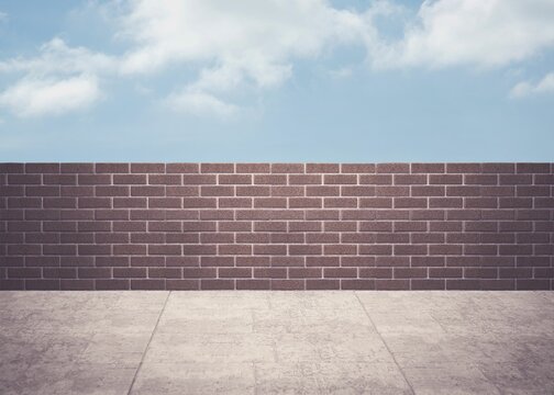 Fototapeta Blue sky over a brick wall