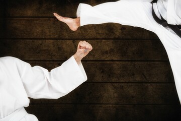 Fighters posing against wooden planks © vectorfusionart