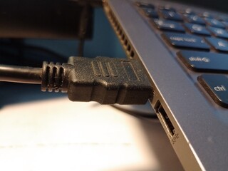 HDMI Cable Plugged into Port on Electronic Device, Close-Up of Connector Insertion for Digital Display or Audio Video Transmission, Ideal for Technology, Connectivity, and Hardware Concepts