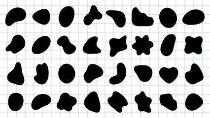 Fototapeta premium Abstract black shapes on a white background. Organic, irregular forms. Various blob-like, fluid shapes. Artistic, abstract design with unique shapes. Black shape vector set.