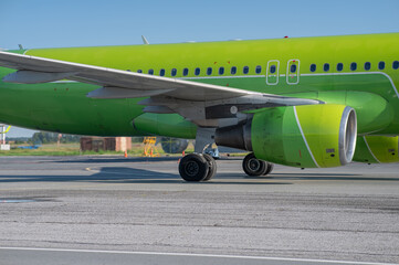 Airplane undergoing repairs in the open air.