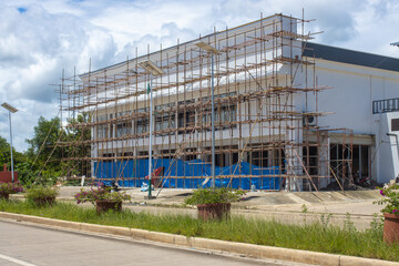 scaffolding on the facade of the building, reconstruction of the building