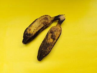 Boiled bananas isolated on yellow background. Traditional Indonesian snack. Healthy food