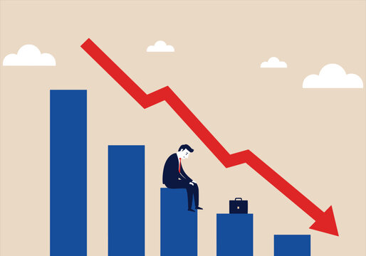 Businessman sitting on declining bar chart, representing financial loss, economic downturn, or business failure, with a red downward arrow illustrating a decrease in performance or profits.