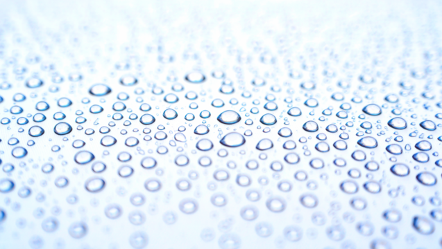 Gotas de agua sobre superficie blanca. 