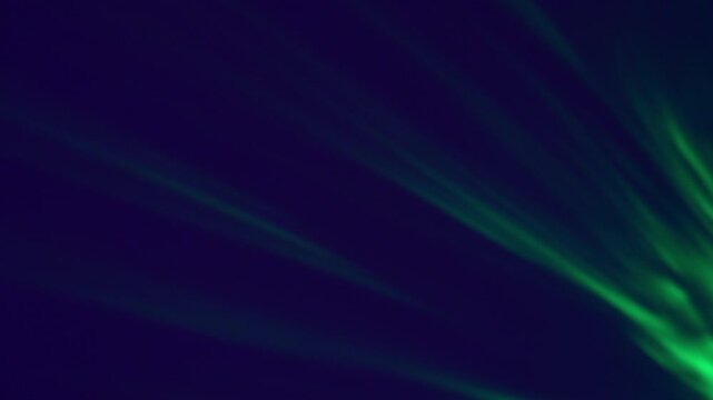 Crisp green beams scatter outward in dynamic motion over a deep violet background.