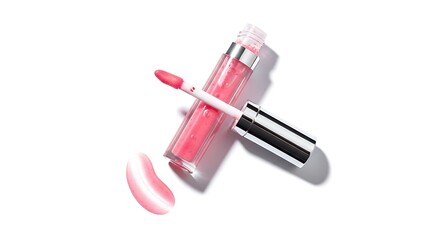 Pink lip gloss with applicator and swatch on white background