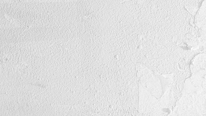 Weathered white concrete wall revealing rough, textured surface with abstract patterns, providing...